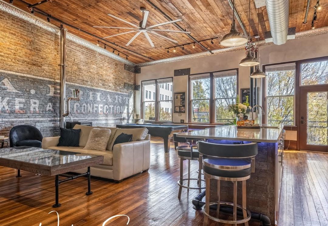 Restored Capone’s Loft interior with exposed brick and timber